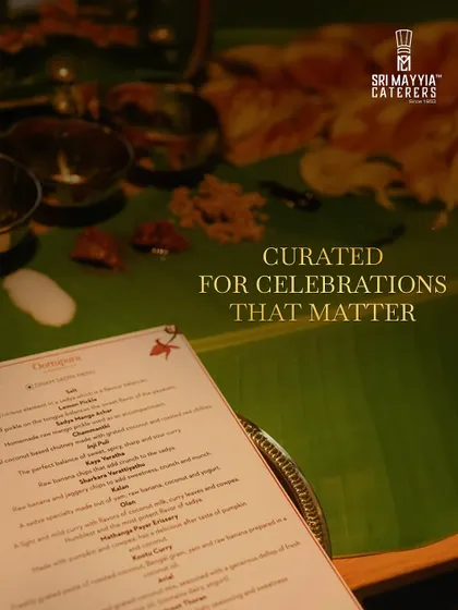 Our menus are curated for celebrations that matter. Here, a detailed menu rests against the backdrop of a traditional feast, promising a journey of flavours.