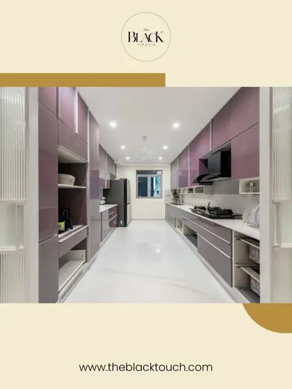 A spacious and luxurious parallel kitchen with glossy purple cabinets and fluted glass details. The design offers extensive storage and counter space, making it perfect for those who love to cook and entertain.