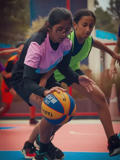 Two players locked in a one-on-one battle for the ball. These moments of intense competition are what define the spirit of my Junior Basketball League.