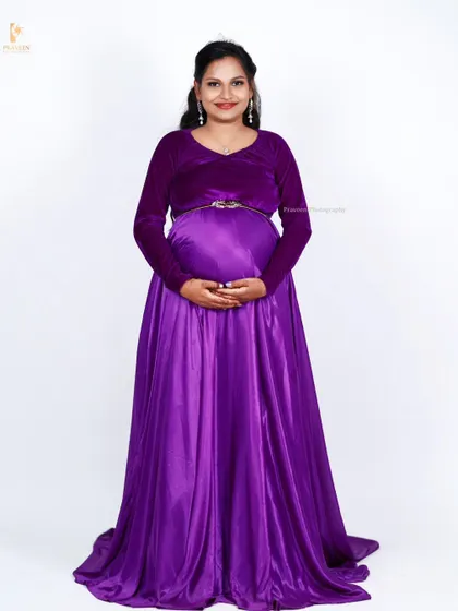 Another look at the full purple maternity gown, showcasing its simple yet elegant design that is flattering for all body types.