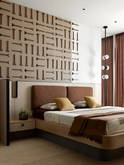 The full view of the bedroom, showing how the custom wall panel, bed, and side tables all work together to create a cohesive and luxurious space.