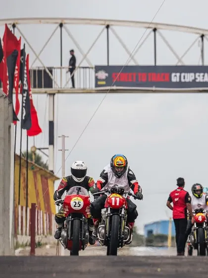 Riders head out of the pit lane for their session at the RE GT Cup. This is where street riders get their first taste of professional track racing.