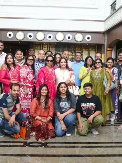 A large group photo of all the guests in the hotel lobby.