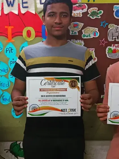 Three of our students holding their certificates of participation after a performance. We believe in recognizing every student's effort and courage to perform on stage.