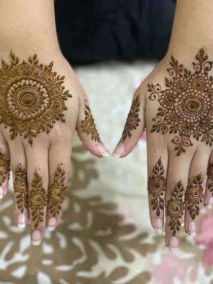 A set of two different mandala designs. One is a classic floral mandala, while the other has a more intricate, sun-like pattern.