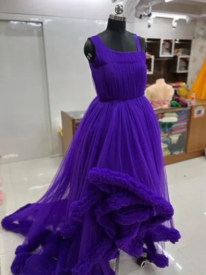 A full view of the stunning purple gown, ready for a client.