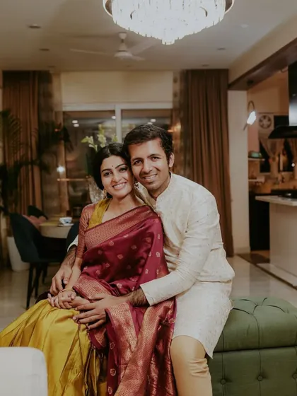 A photo of a happy client couple in their living room.