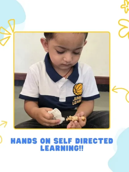 Here, a child is carefully cleaning a small object, an activity that teaches responsibility and care for the environment. This practical life exercise also enhances fine motor skills and the ability to follow a sequence of steps.