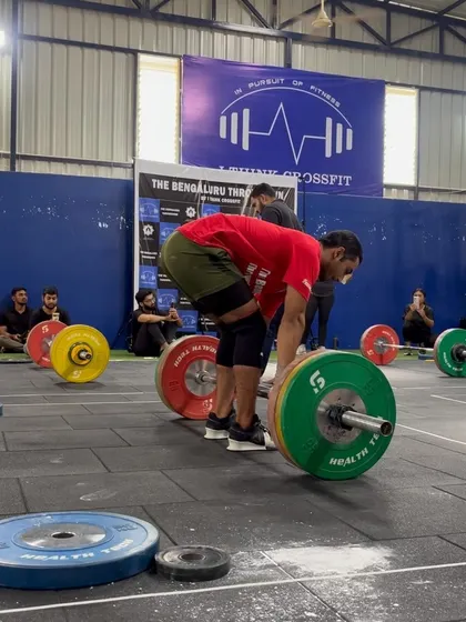 An athlete sets up for a heavy deadlift, a key component of many of our competition workouts.