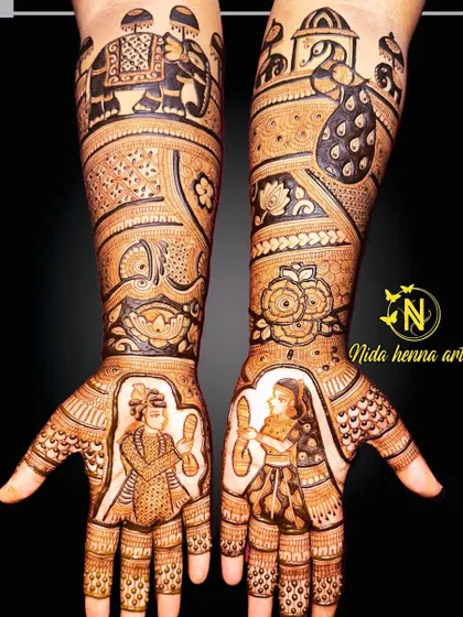 A bridal concept that combines a Varmala ceremony portrait with elephant and peacock motifs on the arms.