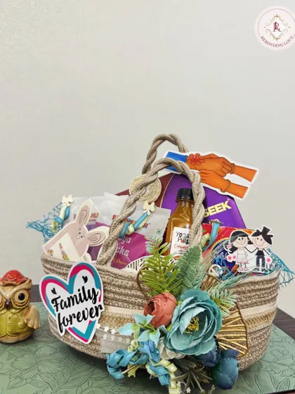 A "Family Forever" themed hamper, this gift celebrates the eternal bond of siblings. The basket is decorated with blue flowers and filled with goodies your sibling will love.