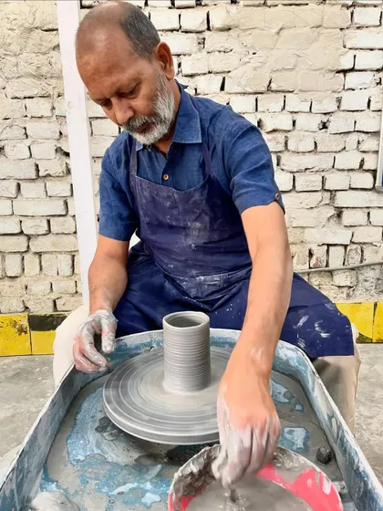 Me at my wheel, finding the center. This is my happy place, where my hands and the clay do the talking. Every piece, big or small, starts with this focused moment.