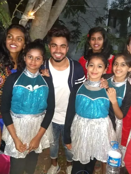 Posing with my students before their Dandiya night performance. We worked on a fun routine that blended traditional moves with modern energy.