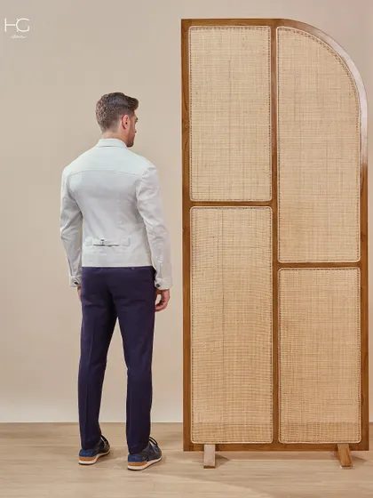 A view from the back of the premium white shacket, highlighting its structured fit and minimalist design details that contribute to its modern elegance.