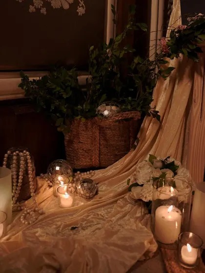 Another view of the floor arrangement, showing how we use soft fabrics, candlelight, and natural textures to create cozy and beautiful corners within a larger space.