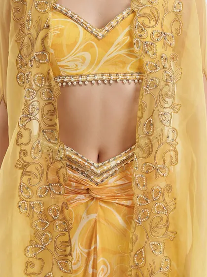 A detail of the Rumi Cape Set, focusing on the abstract cutwork and pearl embellishments that line the organza cape, showcasing my commitment to craftsmanship.