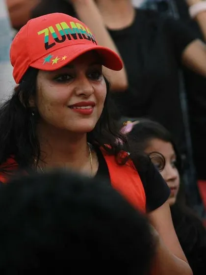 A candid shot from an event, wearing my Zumba cap.