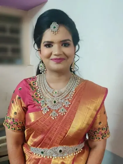 Our happy bride Nikhila, looking beautiful in a layered American diamond and emerald set for her special day.