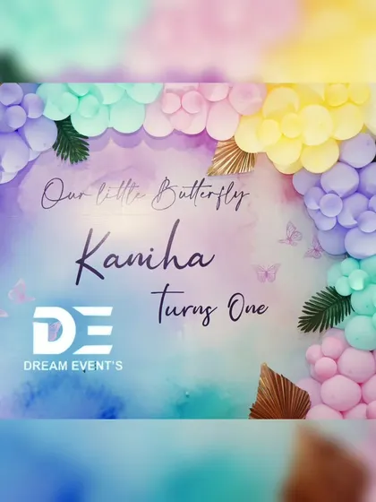A beautiful watercolor-style backdrop for Kaniha's butterfly-themed first birthday. The pastel balloon garland perfectly complements the soft colors of the design.