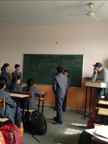 A student presents his ideas at the front of the class, a regular practice to help overcome stage fright. We start with small steps in a safe environment, allowing every child to gradually become a more confident public speaker.