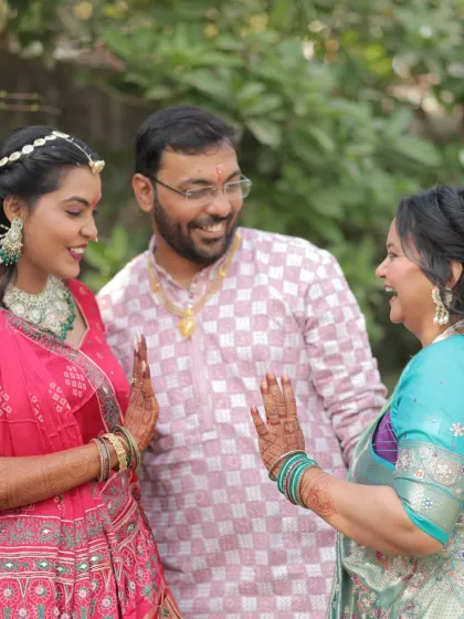 A happy, candid moment with family. The bride's makeup looks natural and beautiful, perfect for these intimate pre-wedding functions.