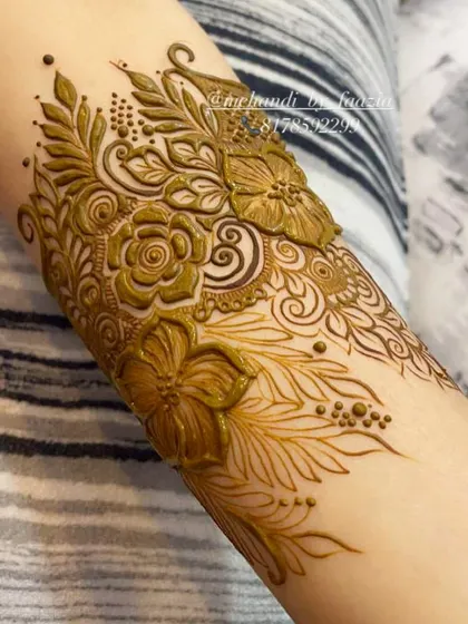 A perfect example of a bridal cuff design. The combination of flowers, leaves, and dots creates a rich texture.