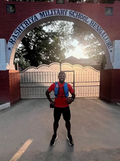 A post-run photo in front of the Rashtriya Military School gate. The sun, the run, the memories.