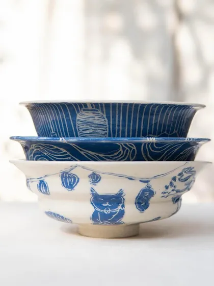 These tastefully made ramen bowls were created by our Foundation students. They are beautifully decorated with detailed sgraffito work inspired by Japanese patterns, landscapes, and culture, turning a functional item into a piece of art.