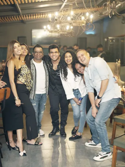 A big group photo with friends and fans. The more the merrier.