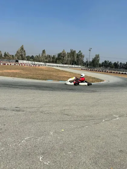 A young driver in a micro-max kart during a pre-season test. We provide advanced coaching for all age categories, helping our youngest talents prepare for national level competition.