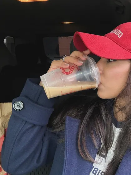 Taking a sip of my iced coffee, a simple pleasure.