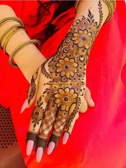 Another angle of the beautiful floral vine mehandi, showing how the pattern wraps around the hand for a complete and polished look.