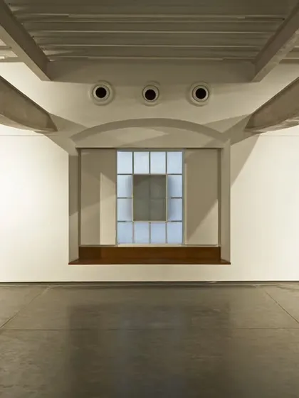 The design for Project 88 gallery involved stripping back a former printing press to its essential structure. The restored industrial columns and beams create a powerful dialogue with the contemporary art displayed within the space.