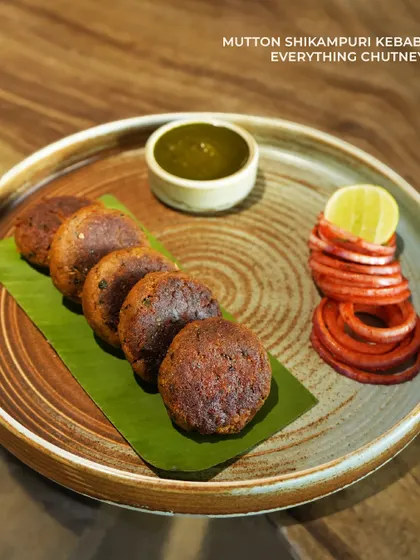 From our Ramzan special menu, the Mutton Shikampuri Kebab. These delicate, melt-in-your-mouth kebabs are pan-fried and served with our 'everything' chutney.