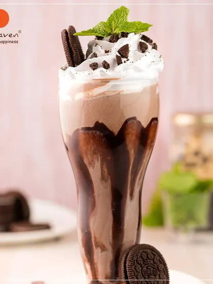 Dive into our Oreo Chocolate Shake, a fan favorite for a reason. We blend rich chocolate and real Oreo cookies into a thick, satisfying shake, then top it with whipped cream and more cookie crumbles. It's pure, chilled indulgence in a glass.