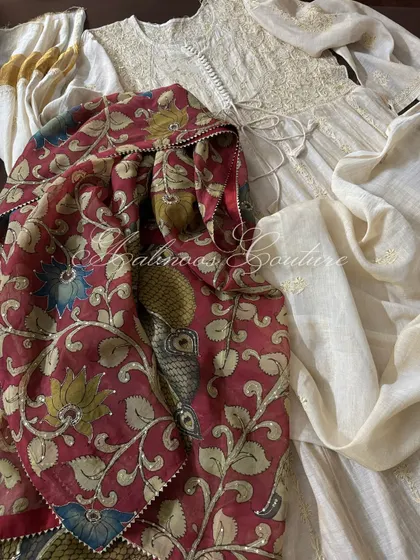 The Anarkali is paired with its statement Srikalahasti Kalamkari dupatta. This view shows how the rich maroon of the dupatta contrasts with the subtle beige of the Anarkali.