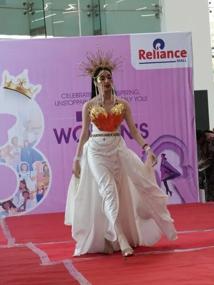 A model walks the ramp in a stunning creation by one of our students during a fashion show held at Reliance Mall for International Women's Day.