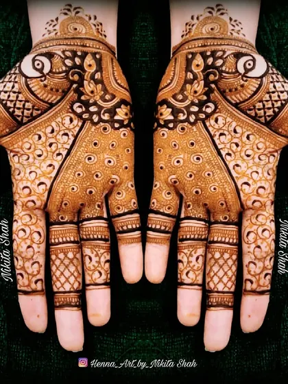 Mehendi is peace (sukoon). This is a classic, full-coverage Indian design with peacock motifs and intricate filler patterns.