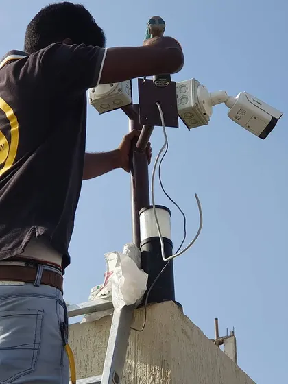 Installing multiple cameras on a single pole for 360-degree coverage. This is a great solution for monitoring open areas like parking lots or yards.