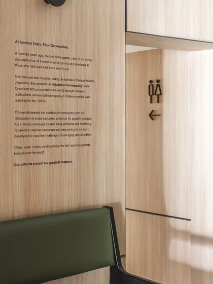 We used environmental graphics to tell the clinic's story directly on the walls. This narrative wall details the hundred-year, four-generation history of the practice, reinforcing its legacy of excellence.
