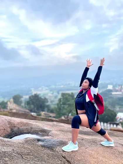 Taking my practice outdoors. Holding a warrior pose on a trek up Shivagange was a milestone. It represents the freedom and strength that comes from a dedicated and patient rehabilitation process.