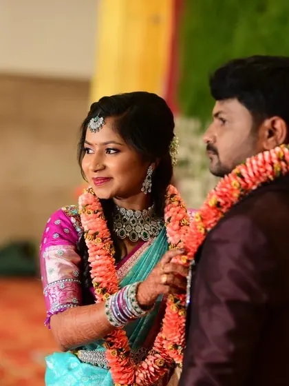 A sweet moment between Apoorva and her partner at their reception. Her makeup looks fresh and radiant even after hours of celebration.