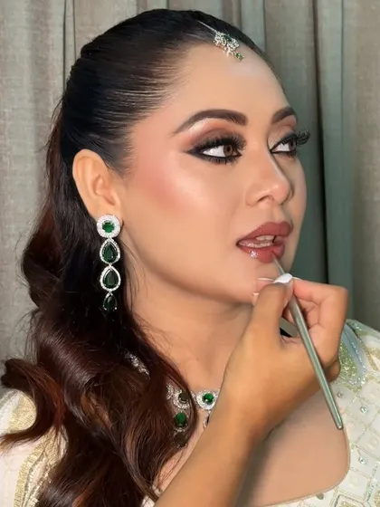 The process of creating the perfect Nikkah look. Here I am defining the lips with a natural shade to complement the bride's defined kohl eyes and radiant skin.