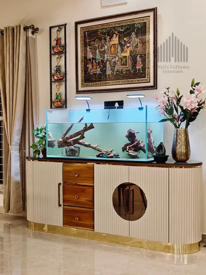 We often integrate unique elements like this aquarium into our furniture designs. This custom console provides a beautiful home for aquatic life while serving as a stunning and functional piece in the living area.