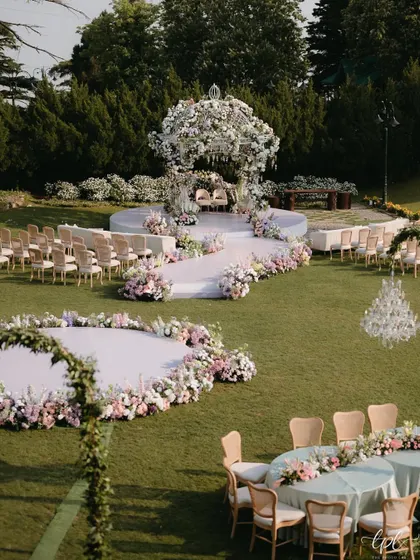 The overall wedding layout in Mussoorie, showing the relationship between the mandap, the guest seating, and the surrounding landscape. The design feels integrated with nature, creating a cohesive and immersive experience.