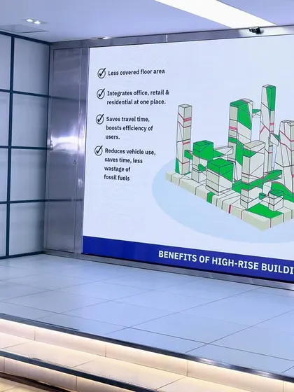 Here I am explaining the core benefits of high-rise buildings during a masterclass. I believe vertical development is crucial for modern cities. It allows us to integrate offices, retail, and homes in one place, which reduces travel time, lowers pollution, and creates space for vital green areas that improve community well-being.