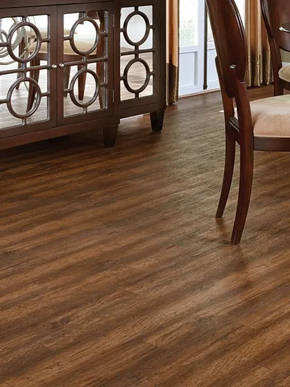 This dark, wood-grain laminate flooring adds a touch of formal elegance to a dining area. It's a durable and easy-to-maintain option that provides the sophisticated look of dark hardwood.