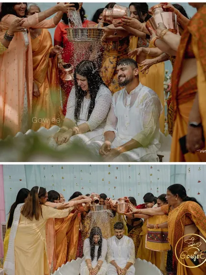 The entire family joins in to shower the couple with blessings and water during the Haldi ceremony.