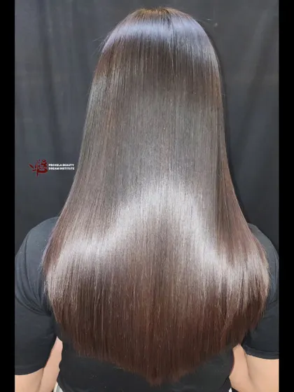 Dreaming of silky, straight hair? This permanent straightening treatment delivers glossy, smooth, and manageable locks, showcasing a dramatic hair transformation.