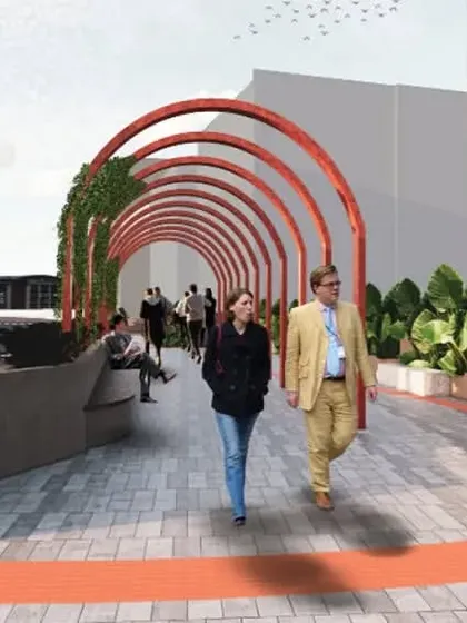For the Embassy Manyata Tech Park, I revitalized a public streetscape to create an engaging pedestrian experience. This section features a series of bold red arches that form a shaded walkway, flanked by integrated seating and lush planters, transforming a simple path into a vibrant public space.